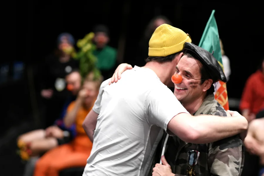 Two performers sharing an embrace during the show.